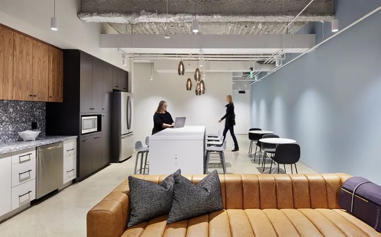 The kitchen space at the Baker Center Spec Suites in Minneapolis, designed by Studio BV, doubles as a workspace and lounge. (Corey Gaffer)