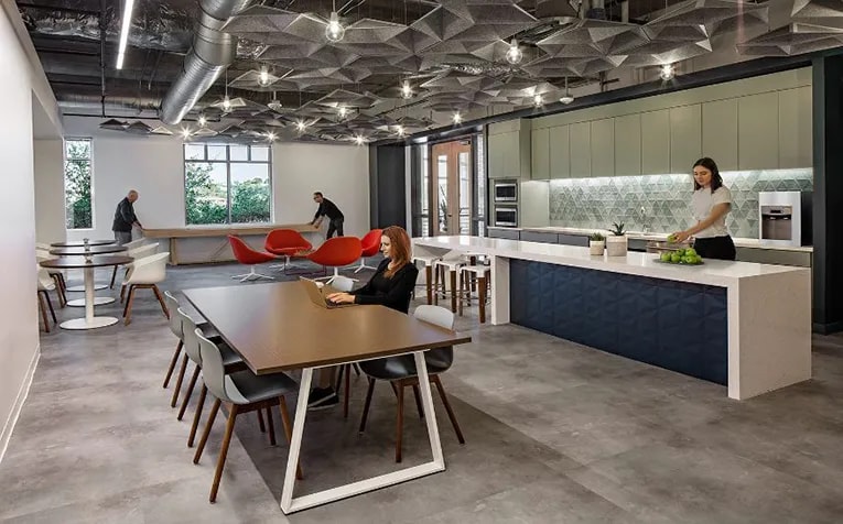 The break room situated at the entrance of Cerity's office allows passersby to see the firm's energetic workplace. (Tre Dunham)