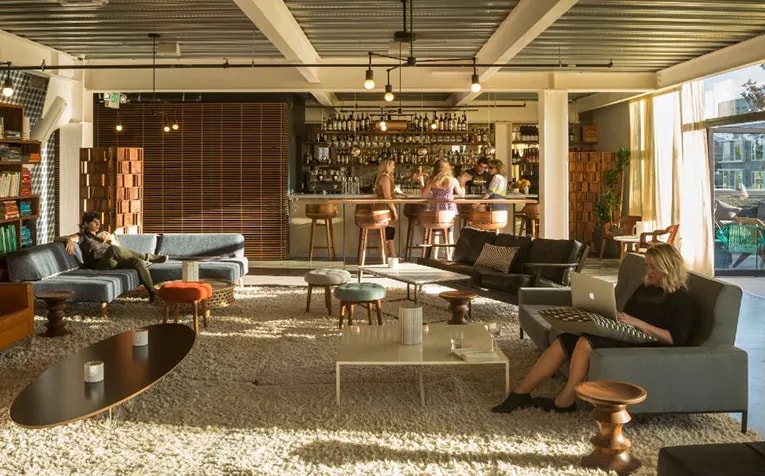 Graham Baba Architects designed the Cloud Room in Seattle, a 5,017-square-foot coworking space complete with a bar and lounge that can be used for private events. (Lara Swimmer)