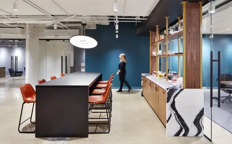 The coffee bar at the Studio BV-designed spec suites in the Baker Center also offer space for working or larger meetings. (Corey Gaffer)