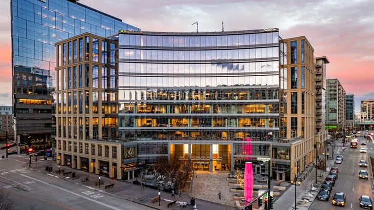 Commercial real estate building exterior view with the sunset in the background