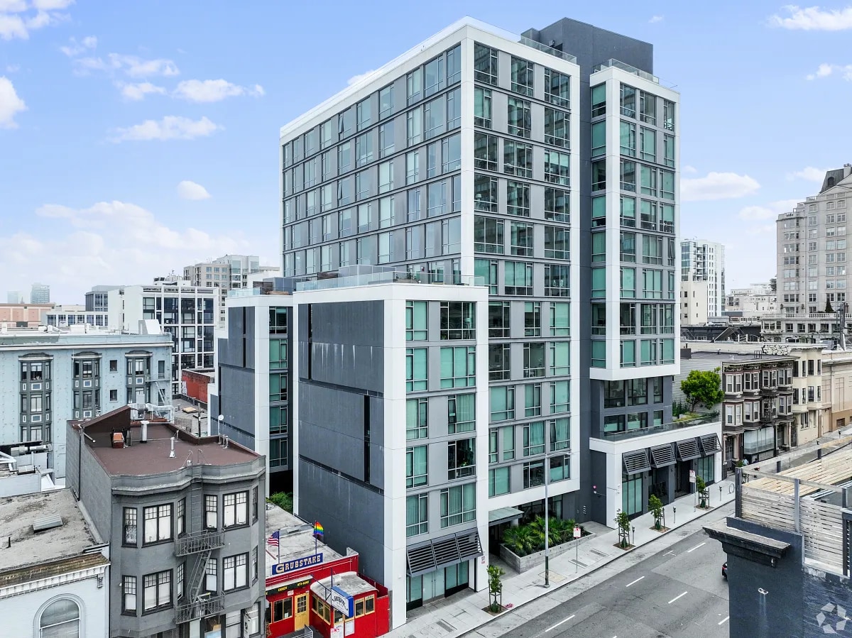 Aerial view of a grey multifamily building in downtown San Fracisco, CA.