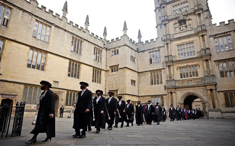 Honorands and senior University members take part in the annual Encaenia ceremony at Oxford University in Oxford, west of London, on September 22, 2021. 