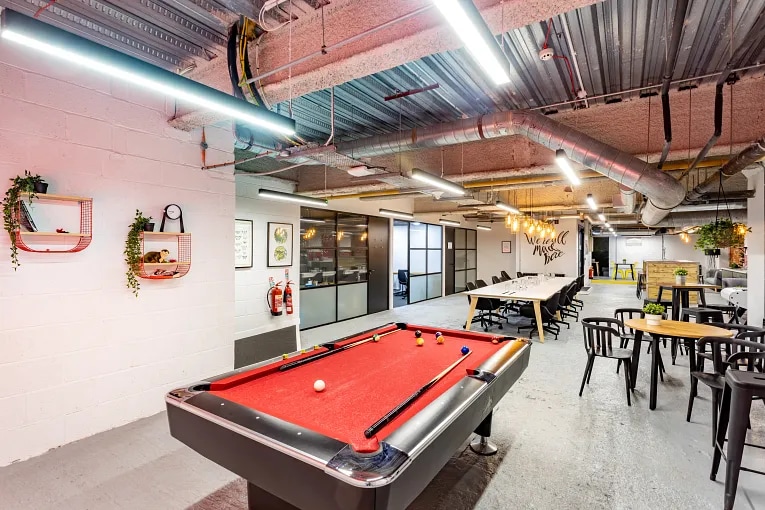 A pool table in a communal area in an office