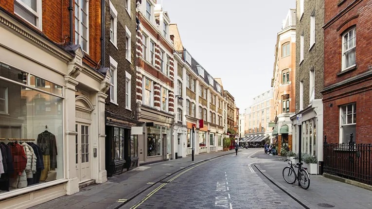 Street with shops and cafes in Marylbone, London. 