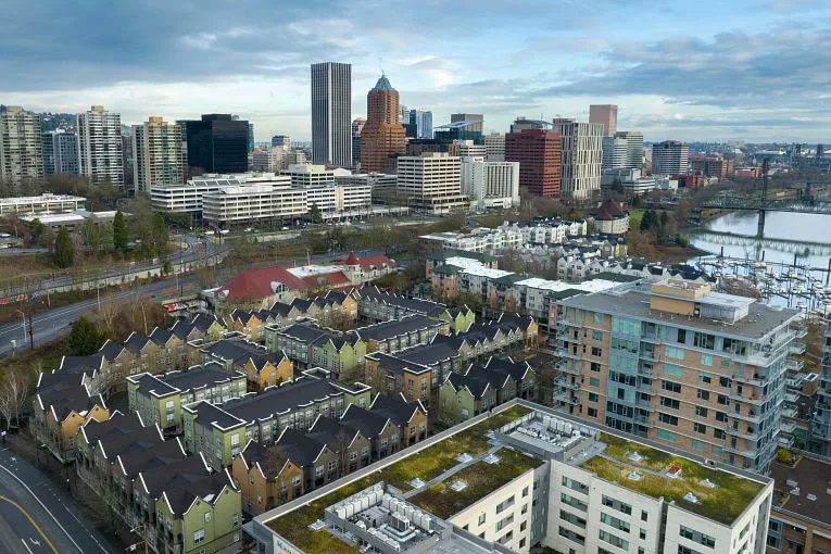 Sunrise view of downtown Portland skyline with multifamily properties in the foreground