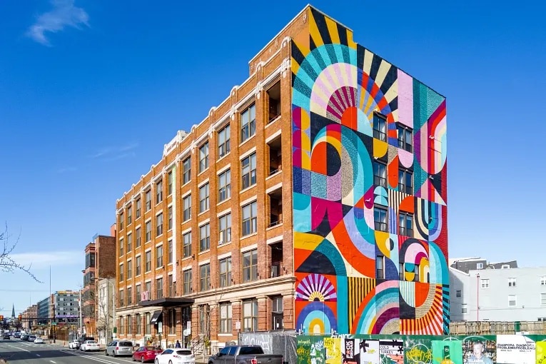 multifamily building with a colorful mural on the side in the Callowhill neighborhood of Philadelphia, PA.