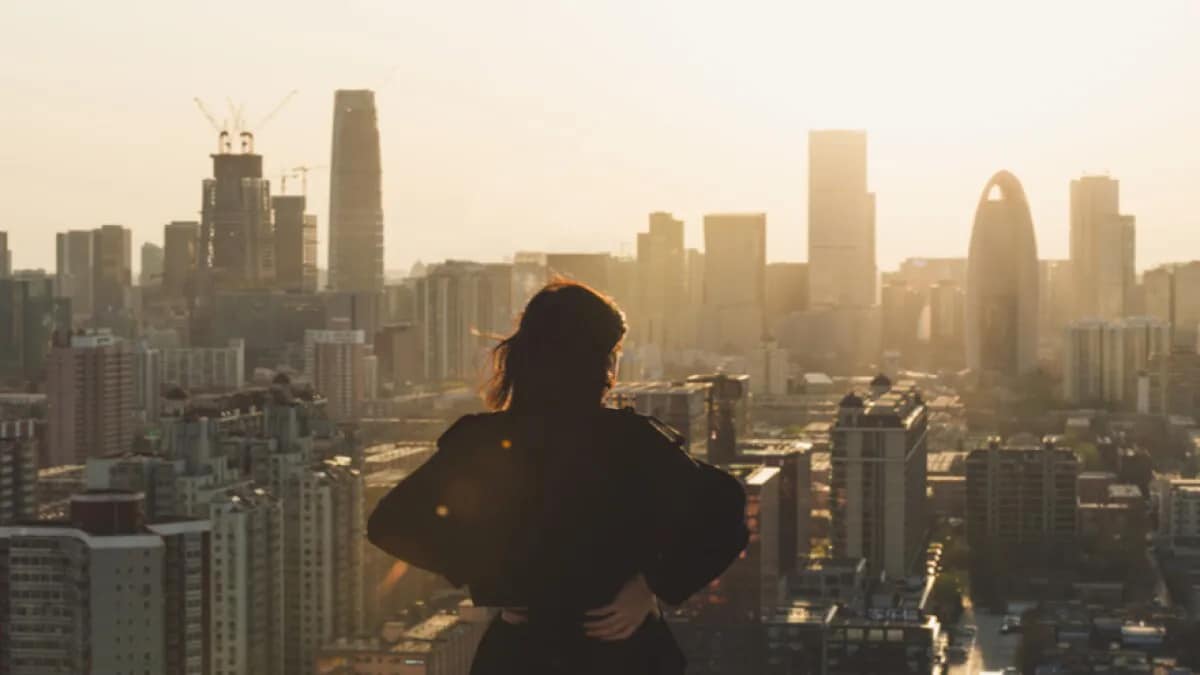 A woman looking out at a cityscape