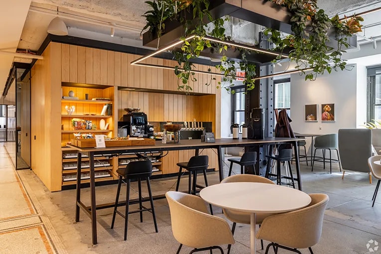 The kitchen and dining area of a coworking space in New York