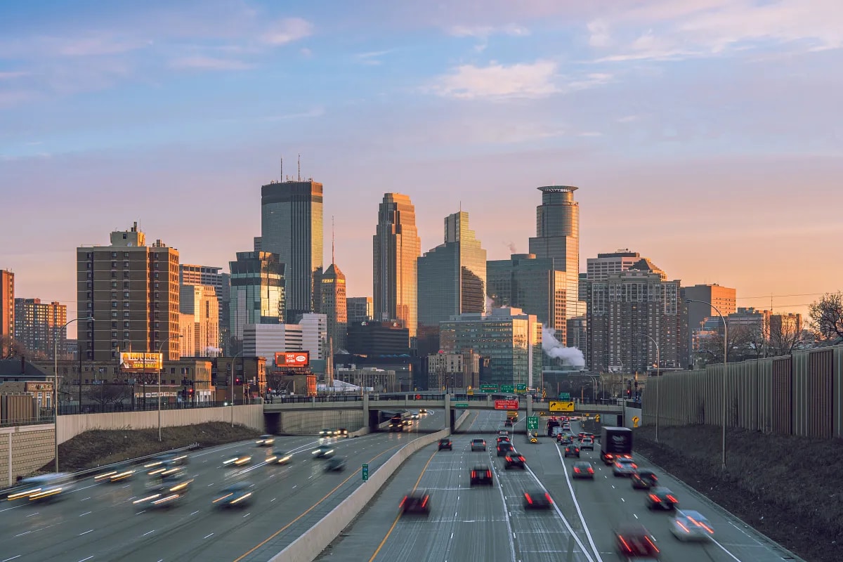 View of the skyline of Minneapolis, MN at sunrise.